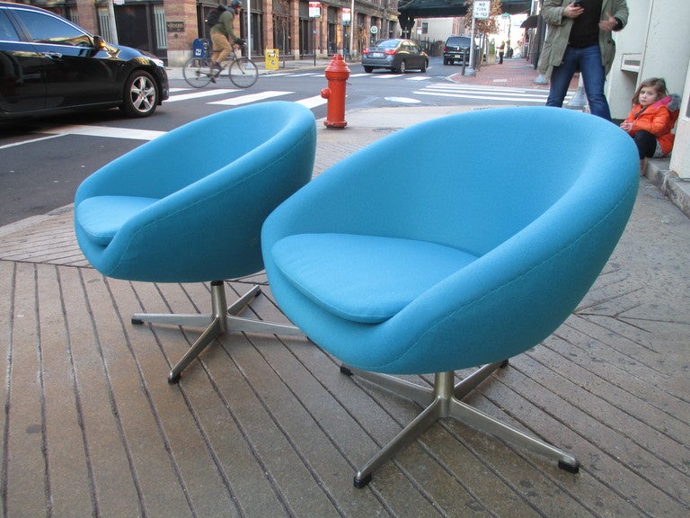 Pair of molded styrofoam chairs covered in original hopsak fabric in color Bahama as listed on label.  Chairs have just been redone in a tourquise crepe.   Chairs are on Fritz Hansen Arne Jacobsen style swivel bases of cast aluminum